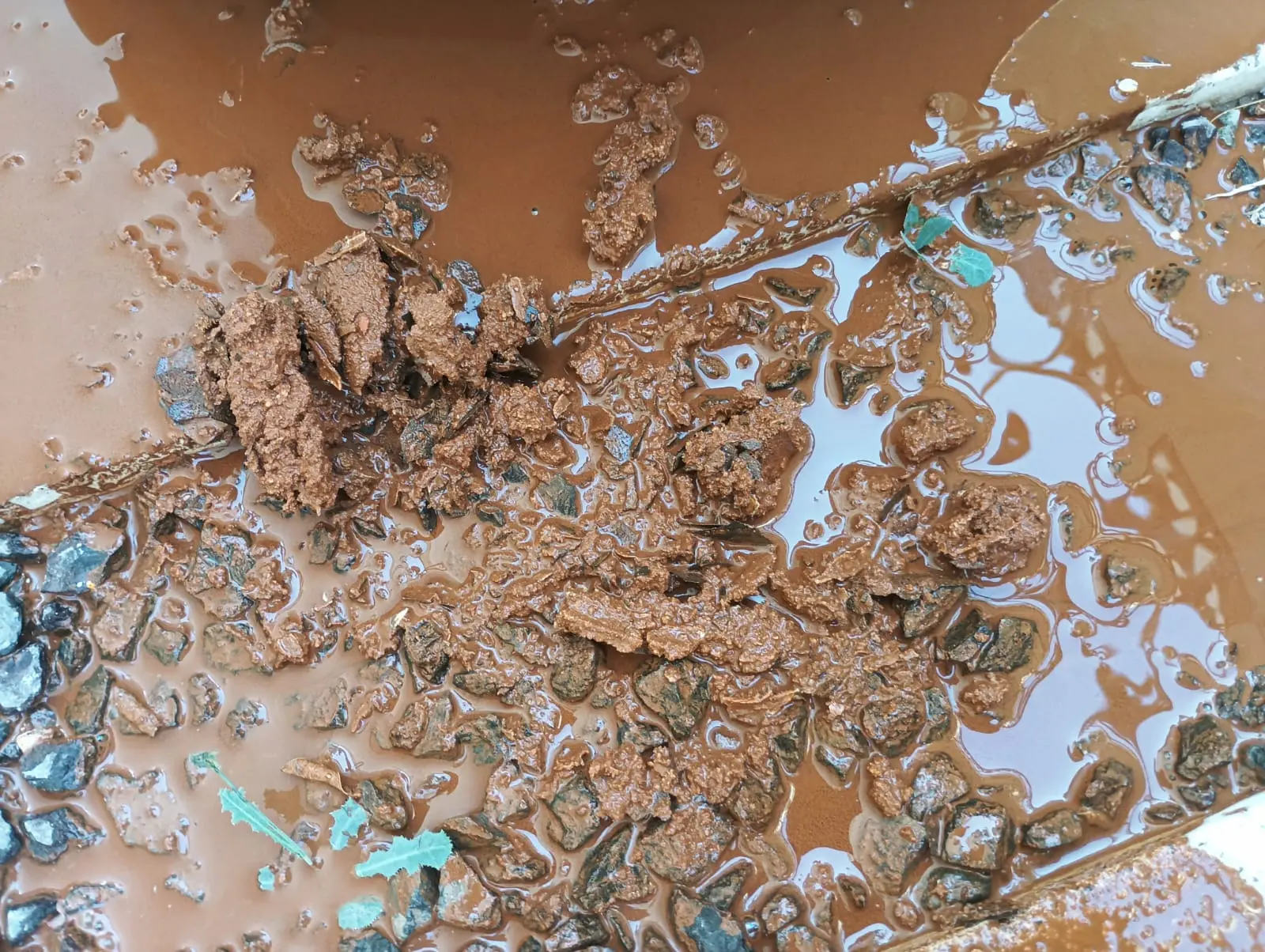 Brown and rusted water coming from a tap